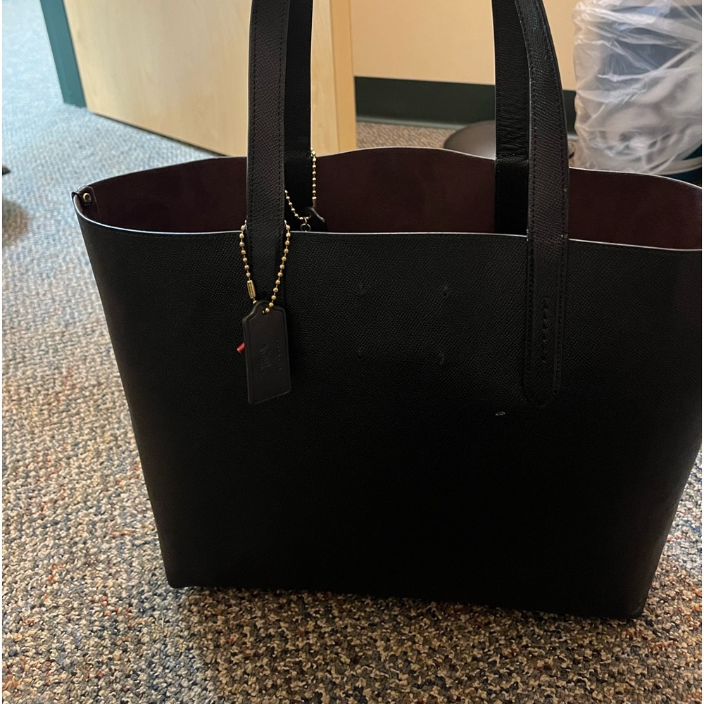 Brand new condition black wizard of oz Coach tote - authentic.